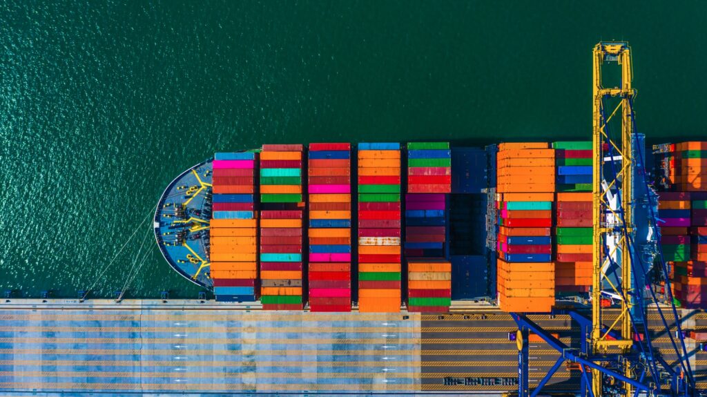 Container ship and cranes at a busy terminal