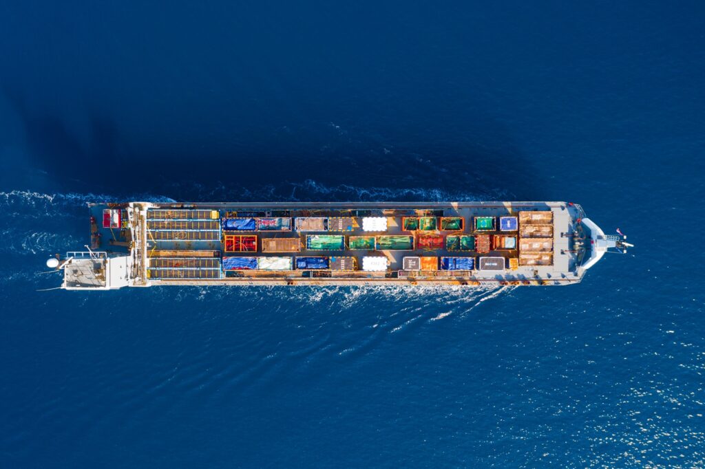 Cargo ship loaded with colourful containers at sea