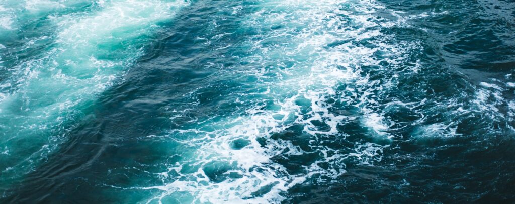 Waves and sea foam on the ocean surface Waves and sea foam on the ocean surface